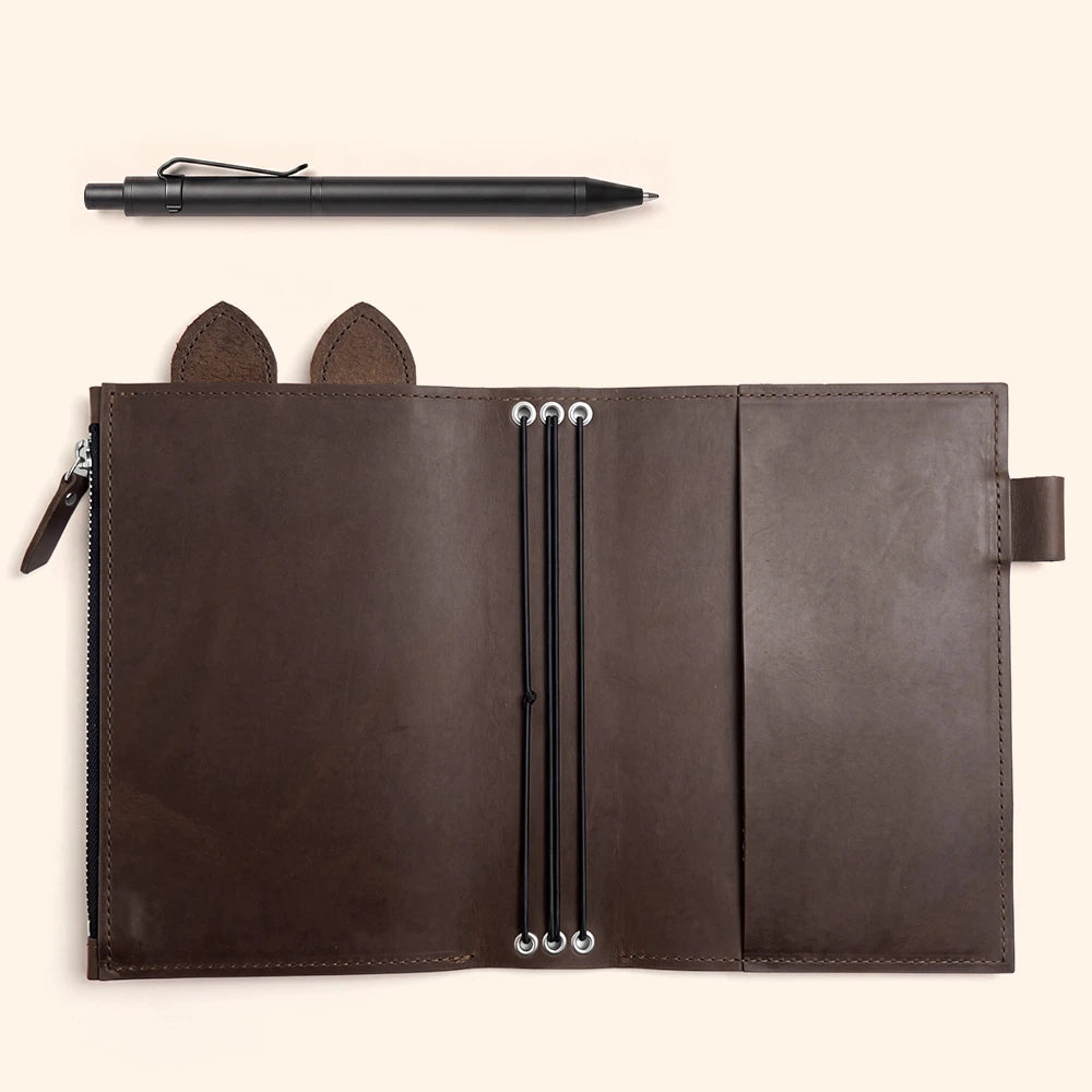 Brown leather notebook cover featuring internal zipper pocket, pen loop, cute leather ears, and elastics.