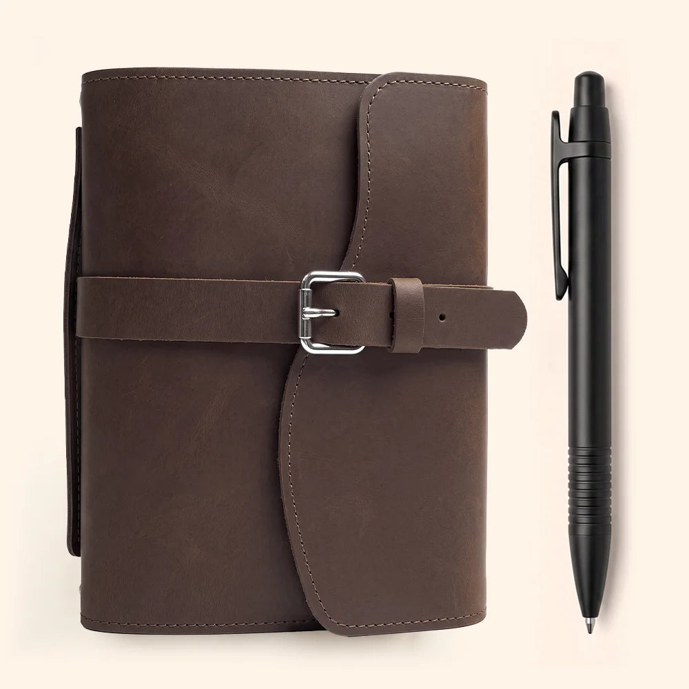 Natural leather notebook case designed with interior storage pockets, pen loop, bookmark, and outer handle.