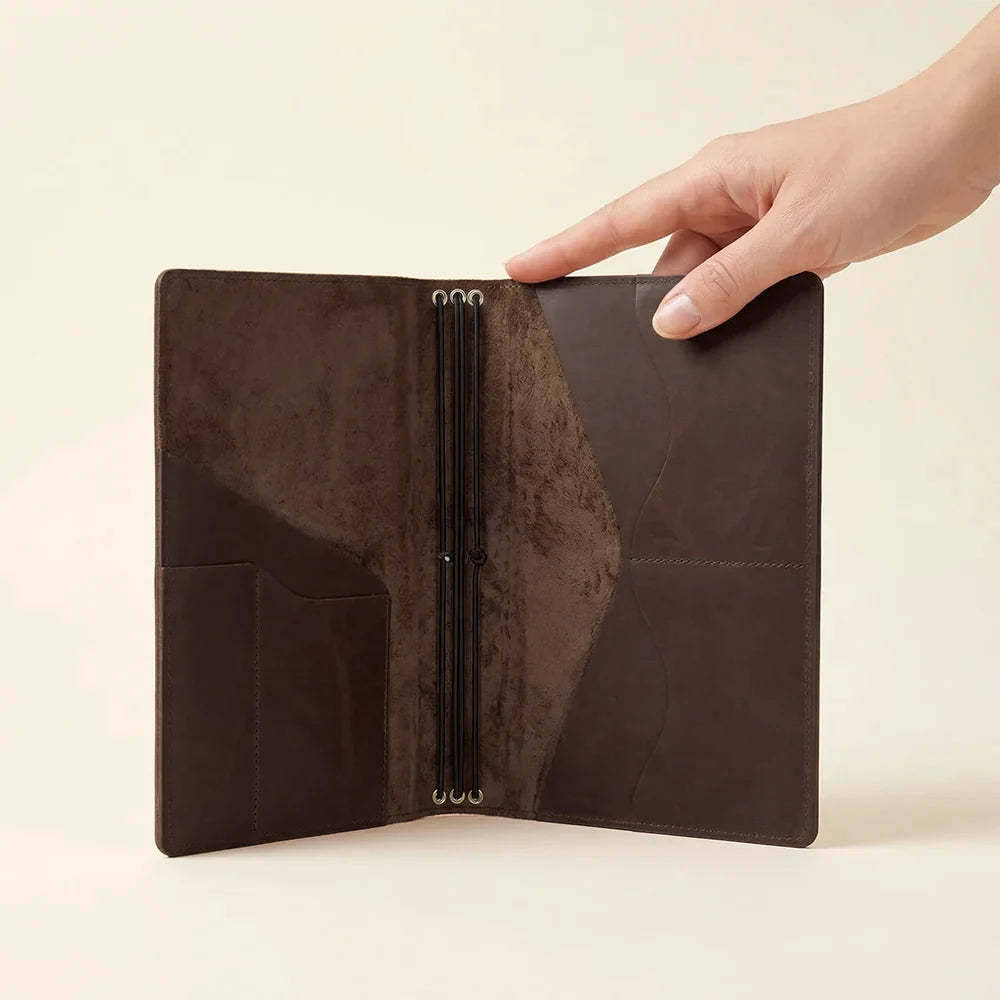 Handmade refillable journal cover crafted from genuine leather with spacious interior pockets.