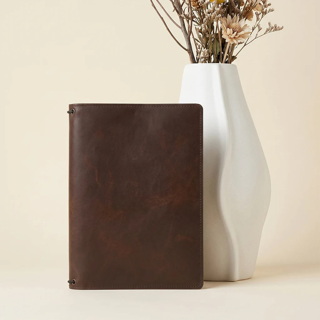 Genuine leather travel journal cover with practical pockets and elastics.