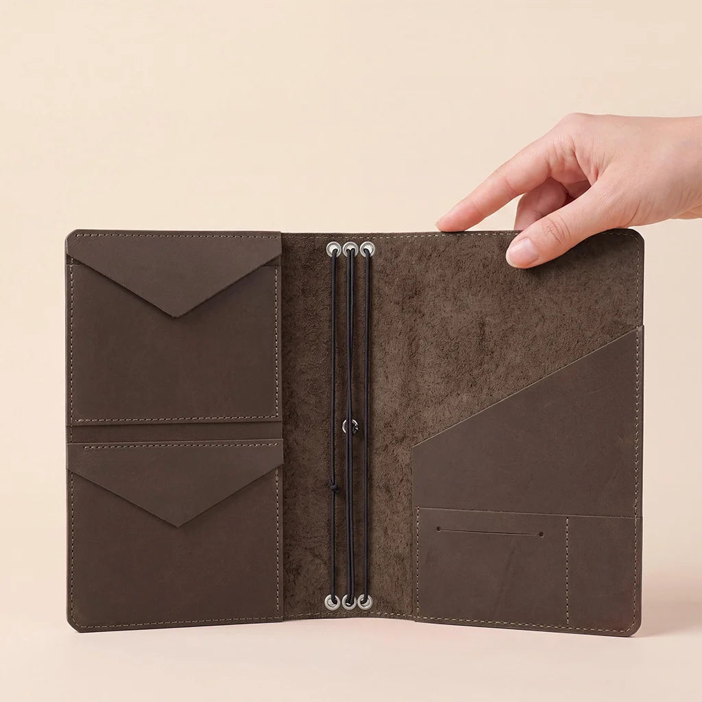Elegant refillable leather planner cover with spacious pockets and durable elastic notebook holders.