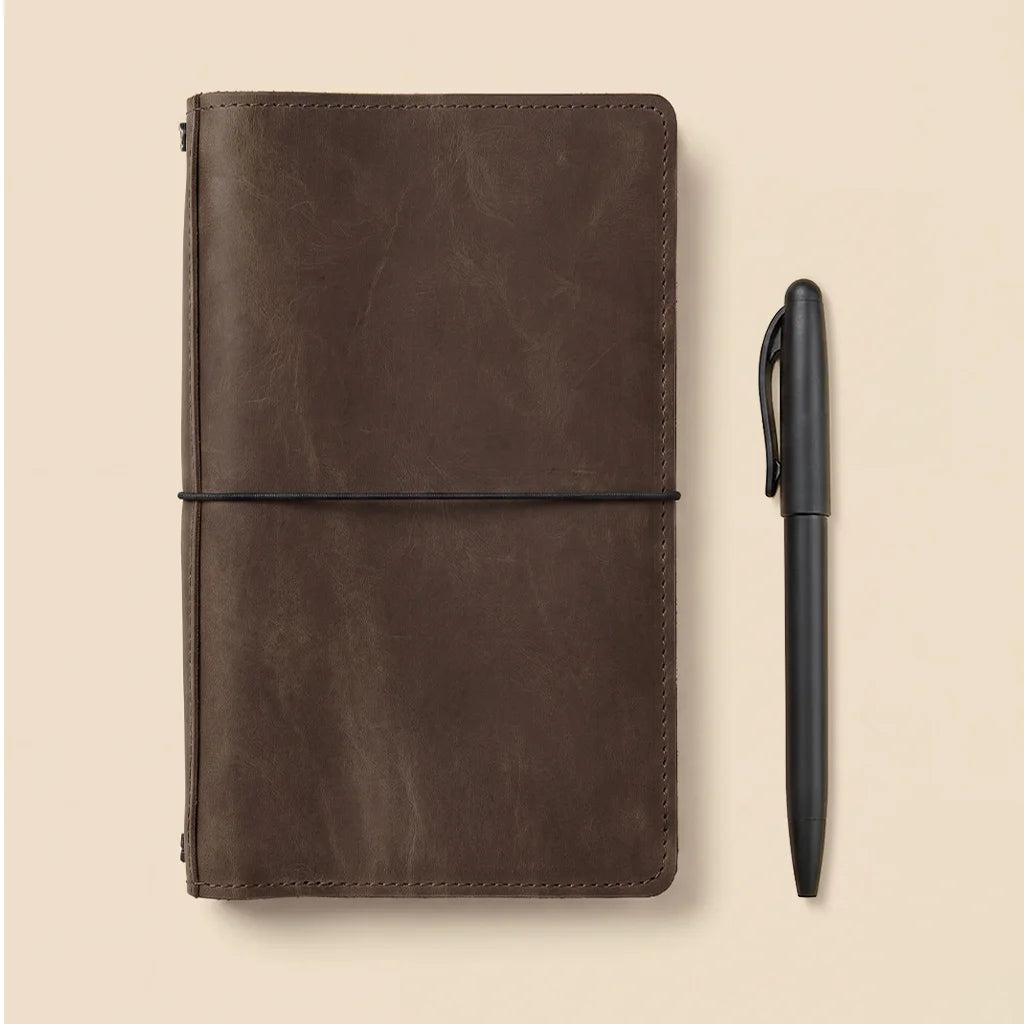Premium leather planner cover designed with elastic cords and multifunctional interior pockets.