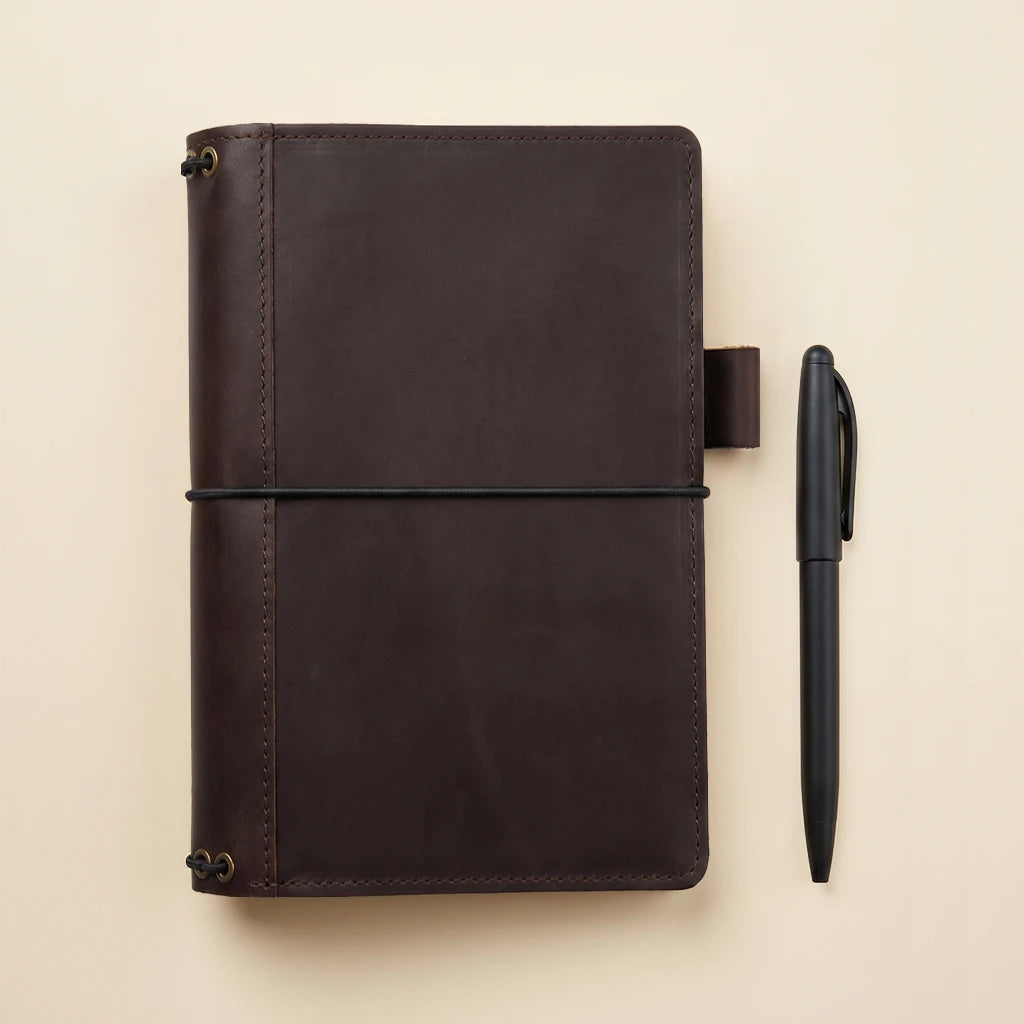 Refillable journal cover crafted from leather with organized interior layout