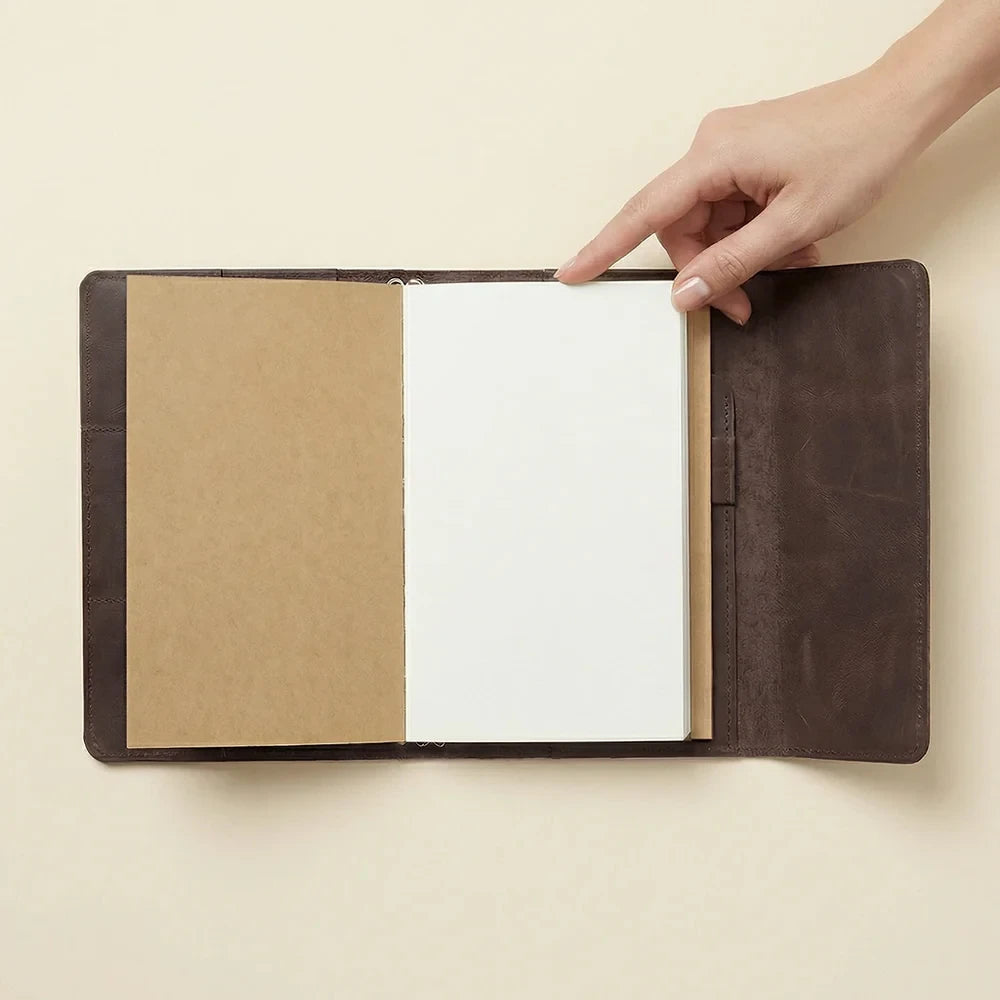 Genuine brown leather journal cover with three elastic bands and roomy inside storage compartments.