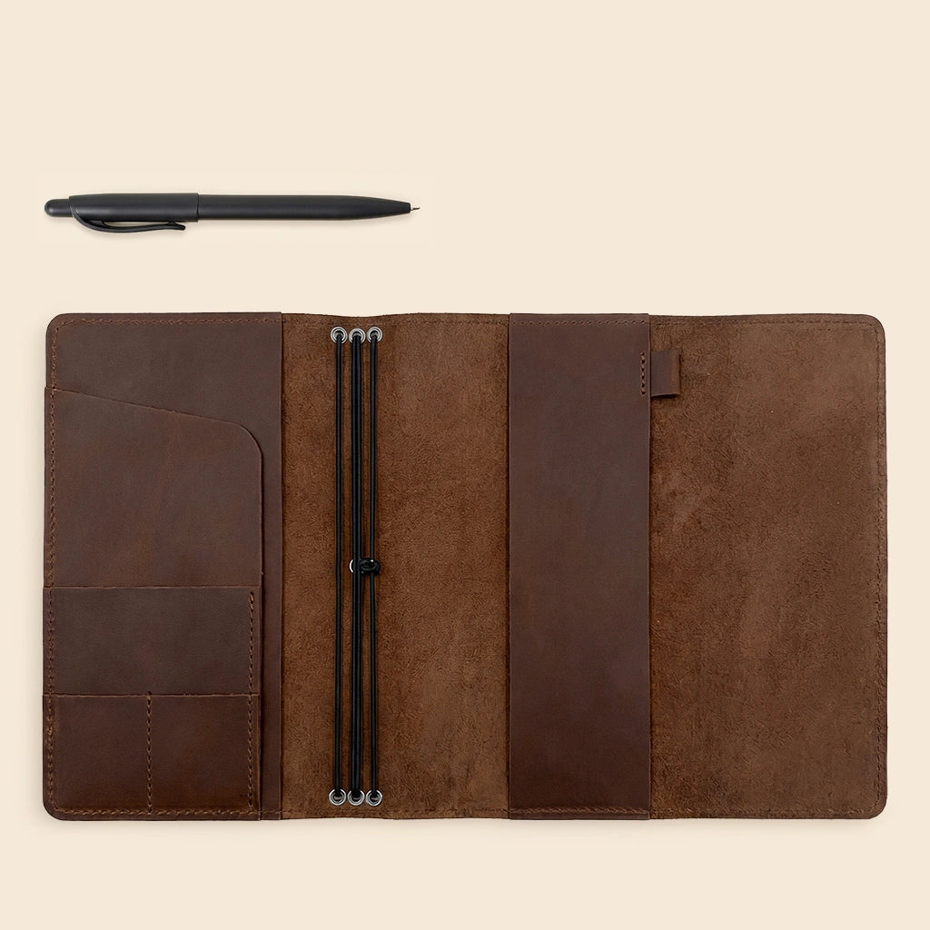 Genuine leather notebook cover featuring elegant handmade stitching and refillable notebook system.