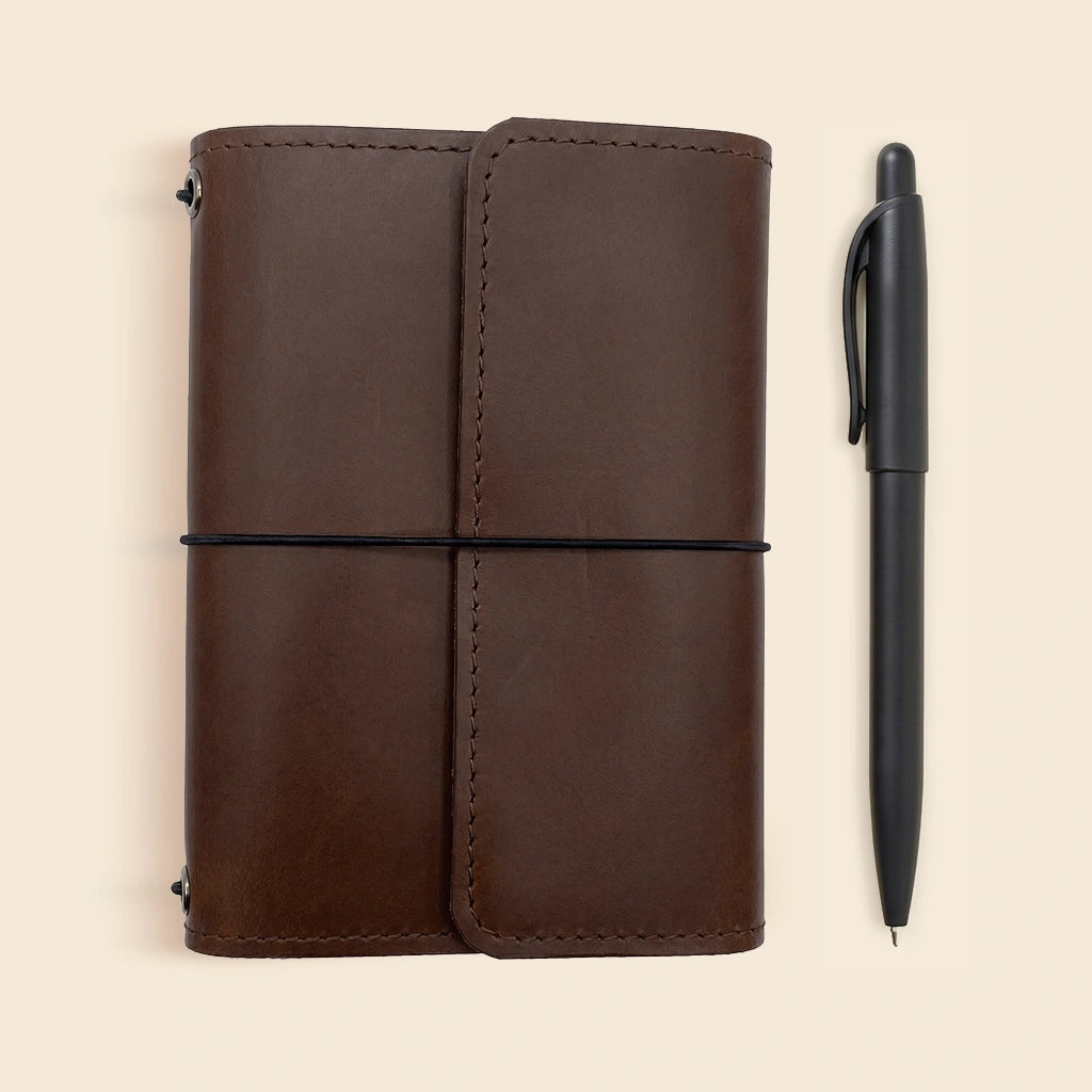 Genuine leather journal organizer with card pockets, pen loop, and refillable design.