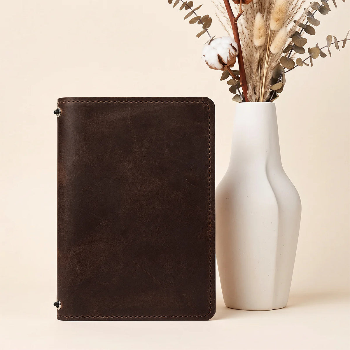Premium natural leather notebook organizer featuring dual elastics and spacious internal pockets