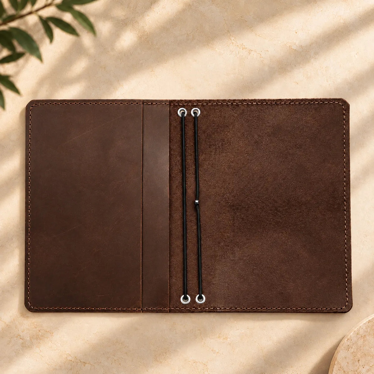Handmade leather cover with two elastic bands and spacious pockets for everyday organization.