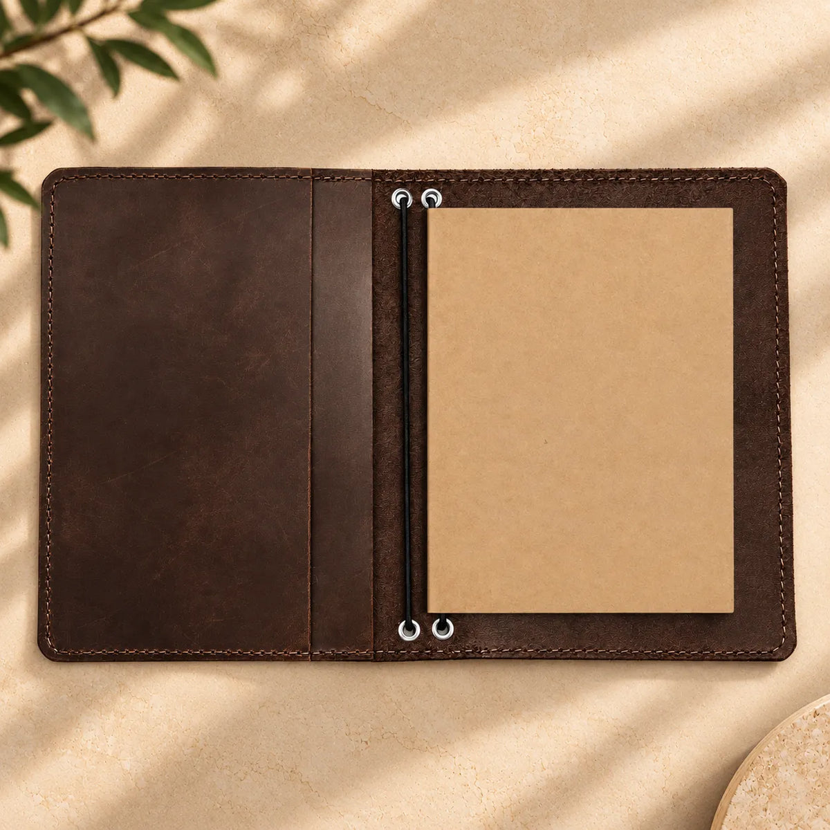 Handmade genuine leather journal cover with two elastic bands and multiple inner pockets.