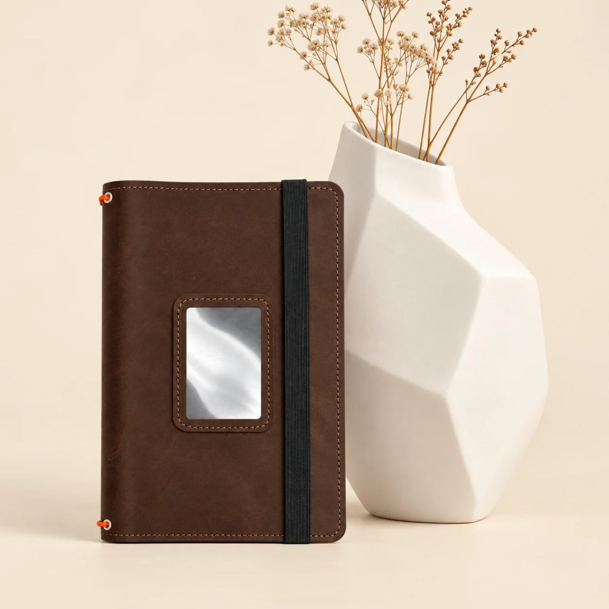 Handmade journal cover featuring three elastic bands and convenient pockets along the interior.