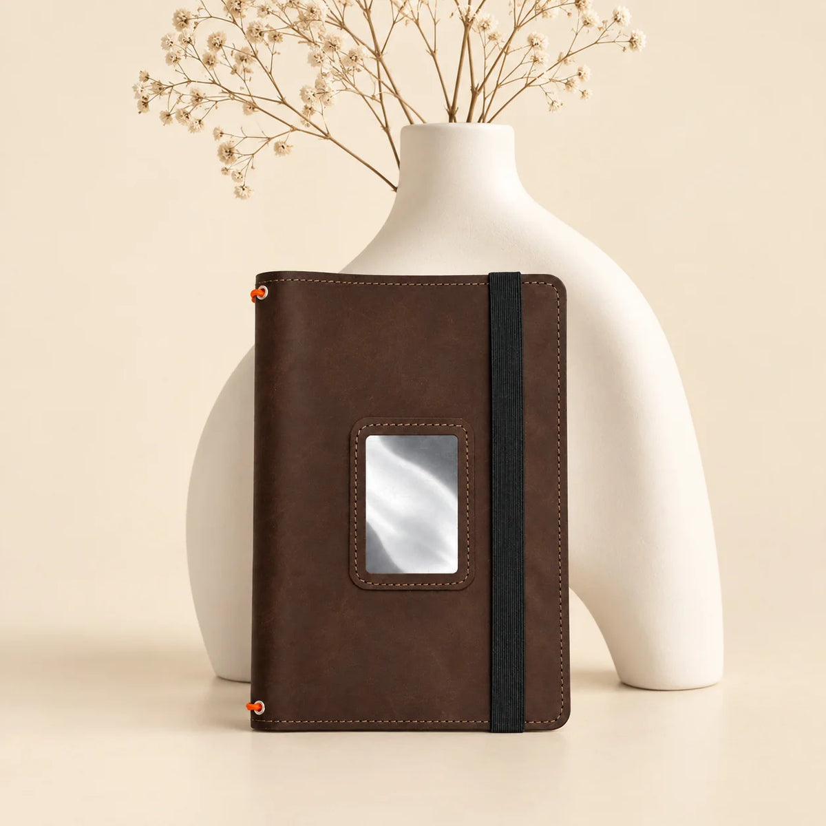 Handmade genuine leather notebook cover with three elastic bands and spacious pockets inside.