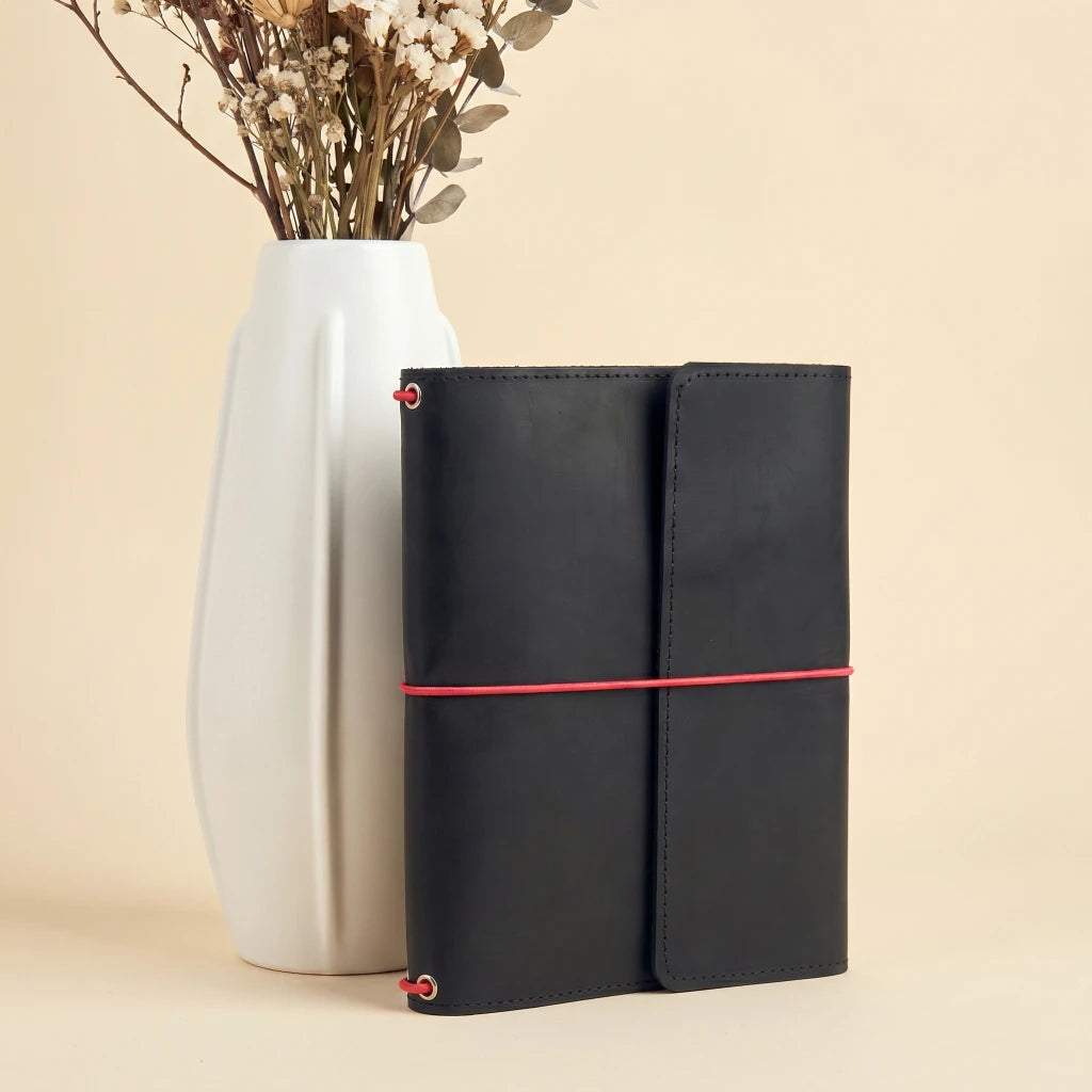 Durable leather journal cover with elastic straps for everyday writing essentials