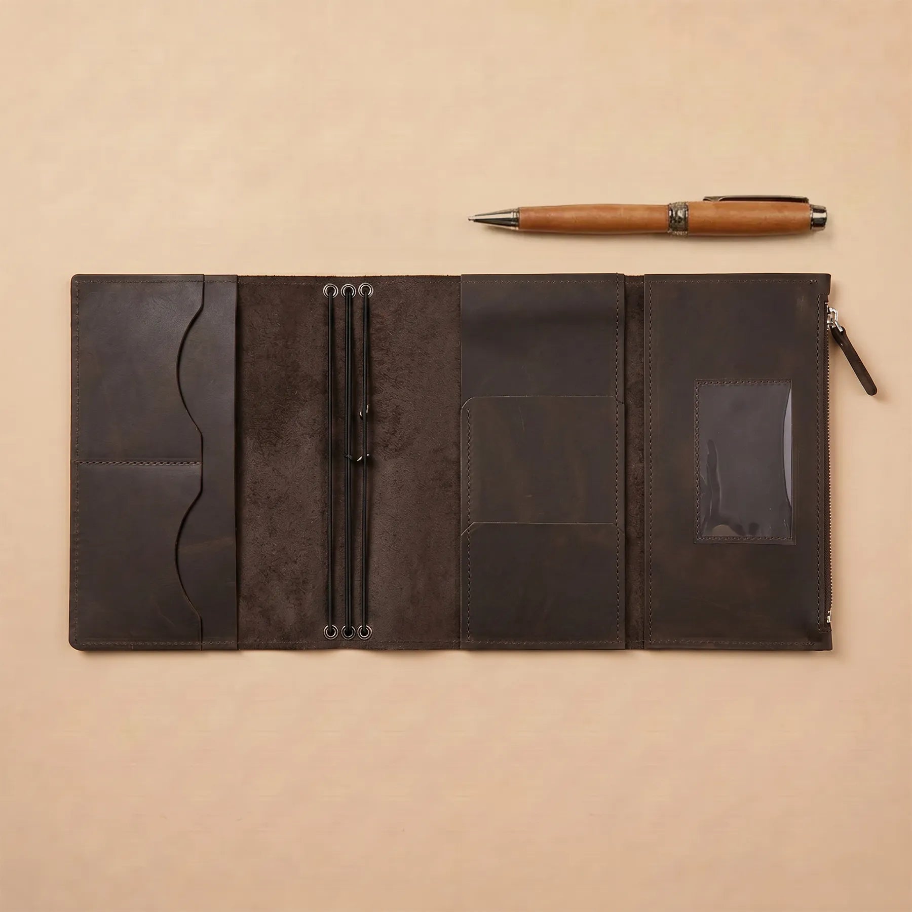 Leather notebook cover with refillable inserts and handcrafted genuine leather exterior.
