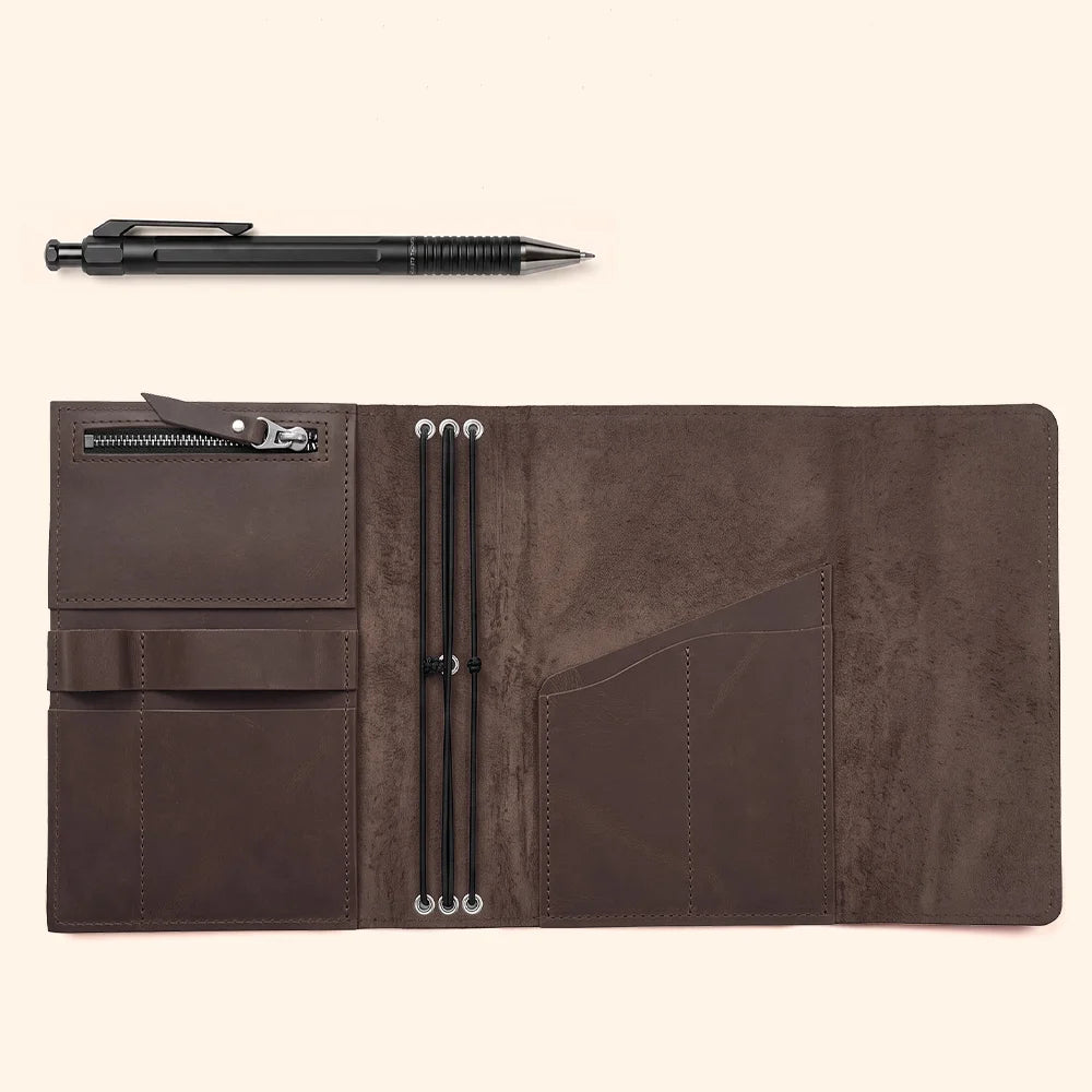 Handmade leather journal case with organized storage pockets and an integrated pen loop.