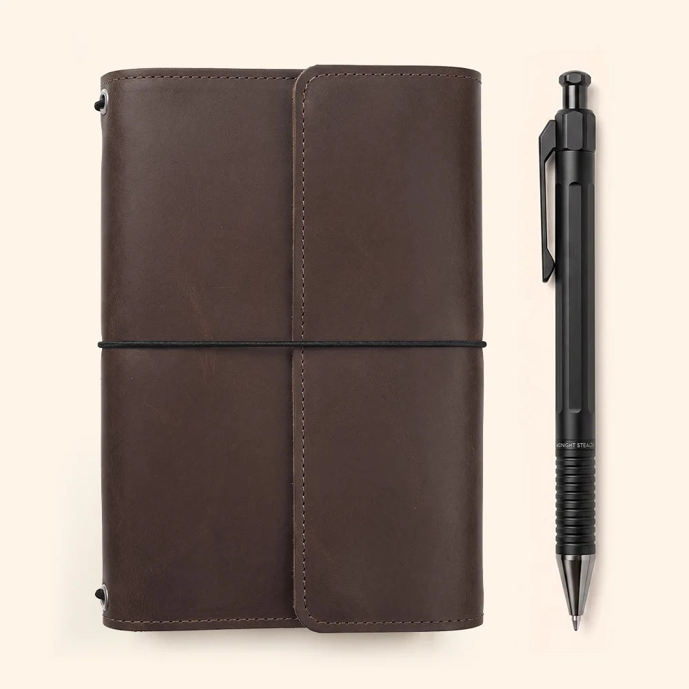 Handmade journal cover with practical interior storage and a convenient pen holder.