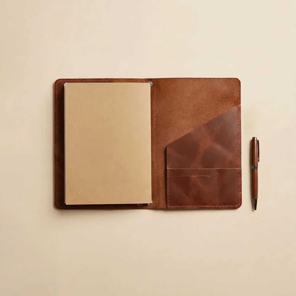 Genuine leather notebook organizer offering secure elastic straps and built-in document pockets.