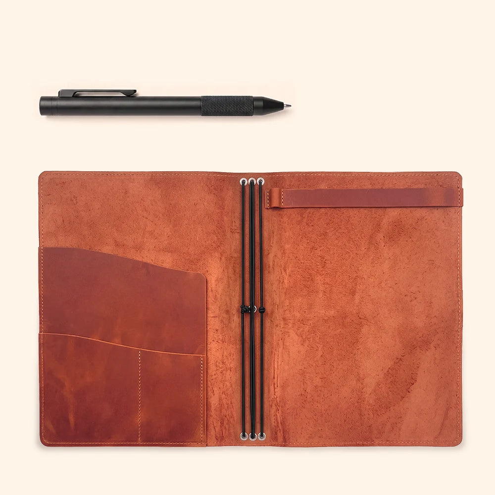 Genuine leather notebook organizer featuring elastic straps, storage pockets, and sketchbook fastening.