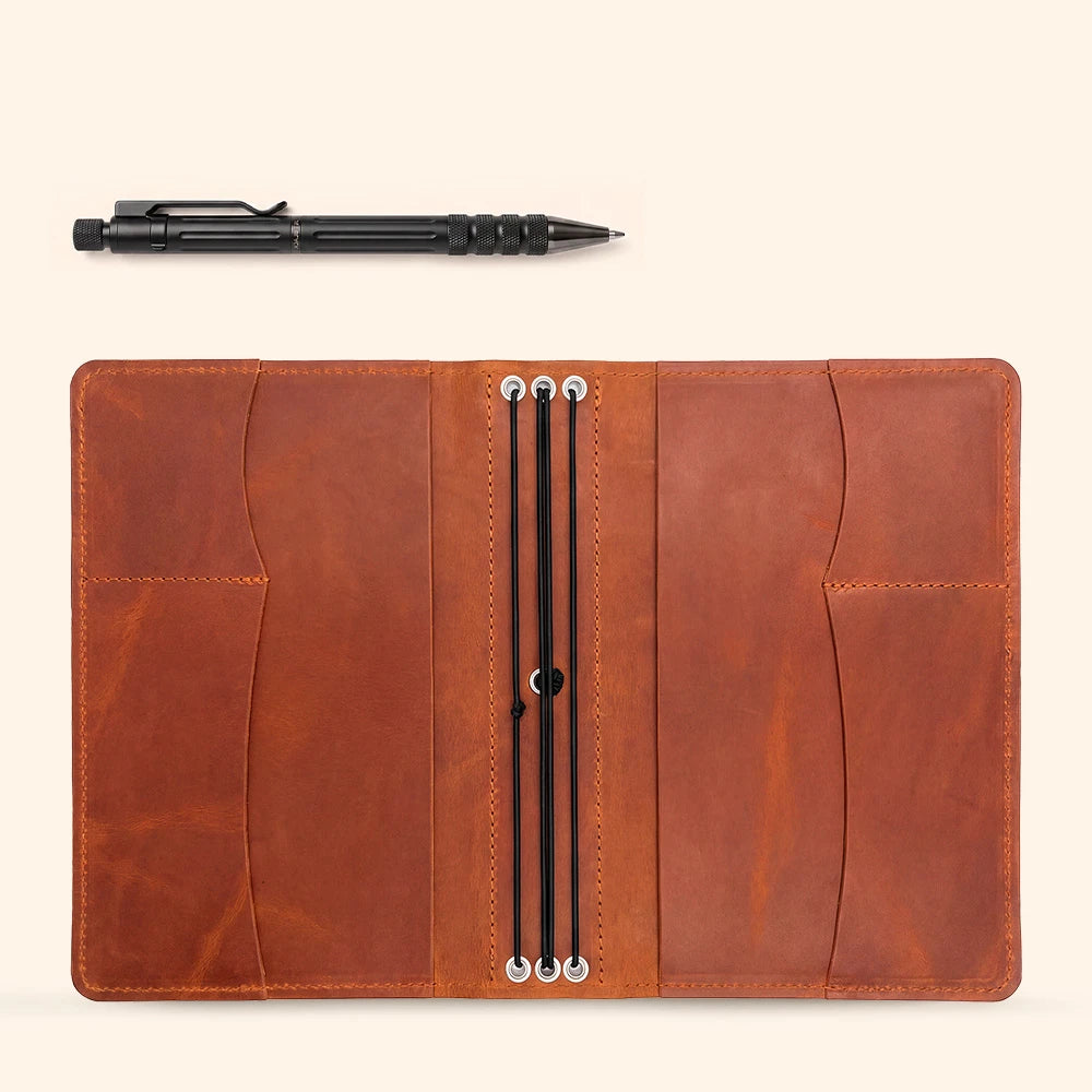 Leather journal cover featuring interior organizer pockets and stitched pen holder for convenience.