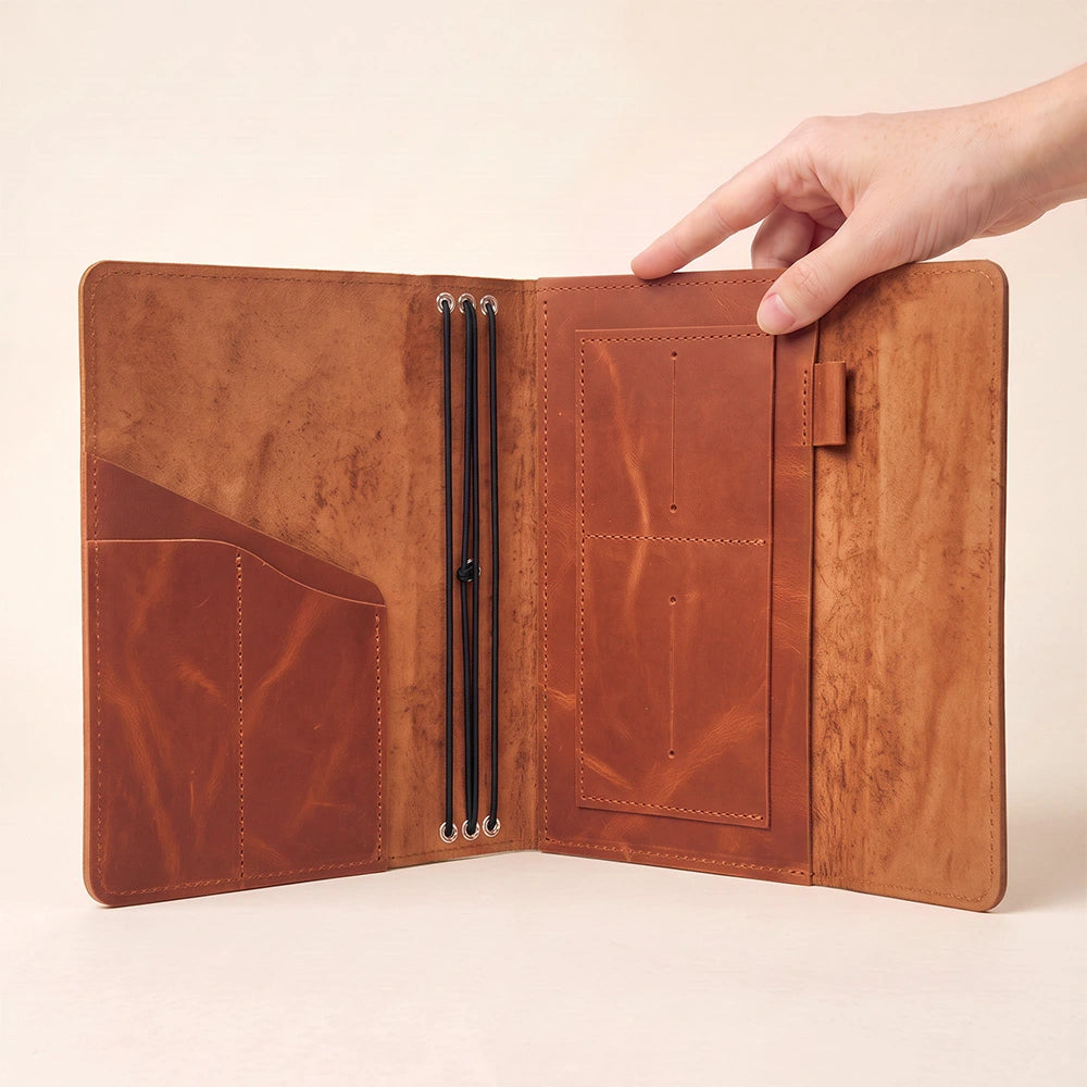 Full grain leather journal cover with practical storage pockets for notes and accessories.