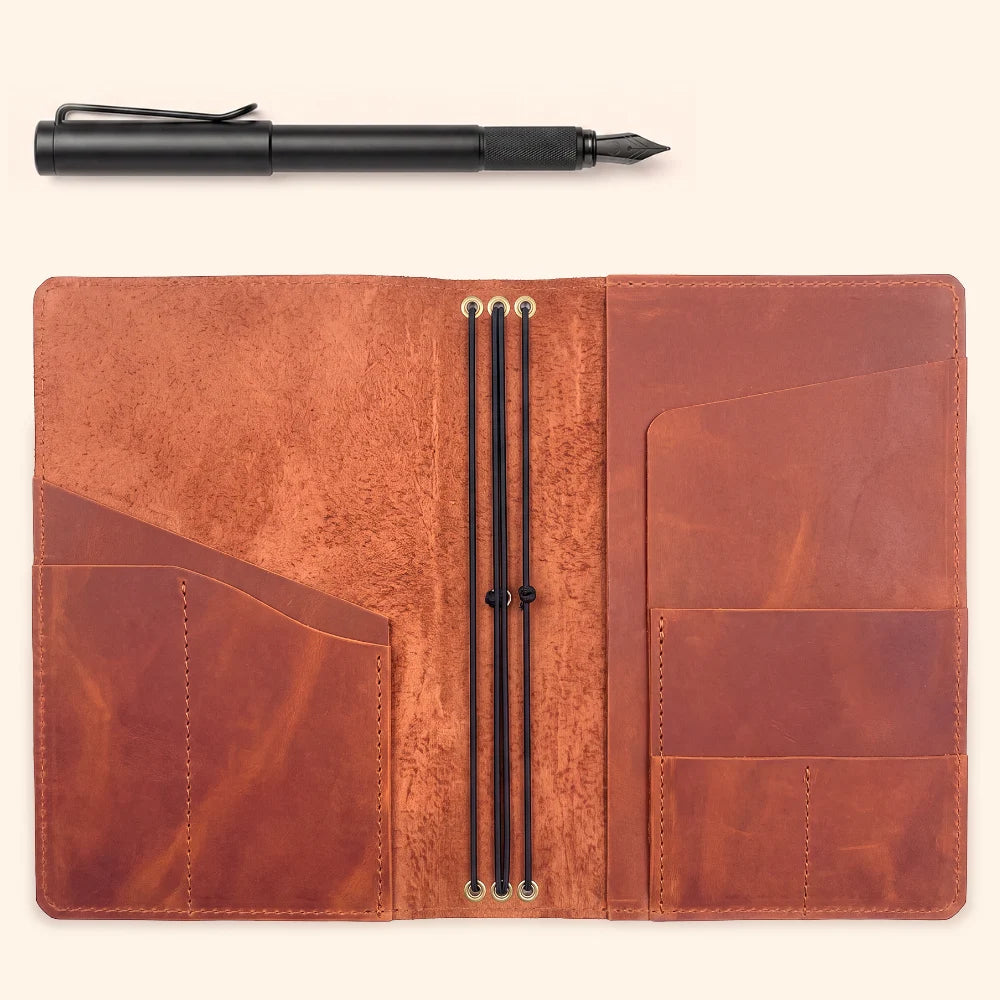 Handmade genuine leather notebook cover with three elastic bands for flexible journal organization.