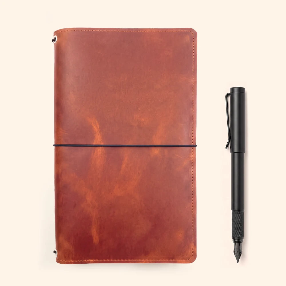 Full-grain style leather notebook cover with triple elastic insert fastening system.