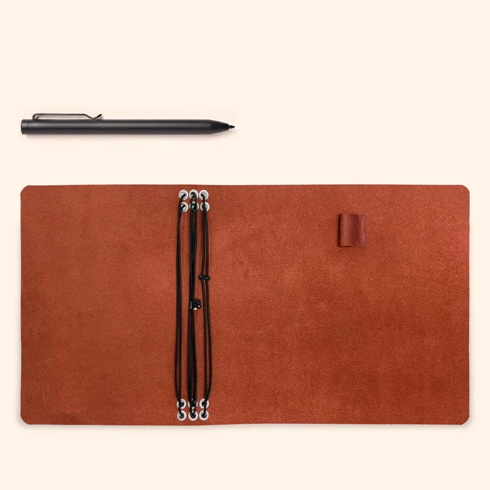 Handmade leather planner organizer featuring six elastic holders for multiple inserts.