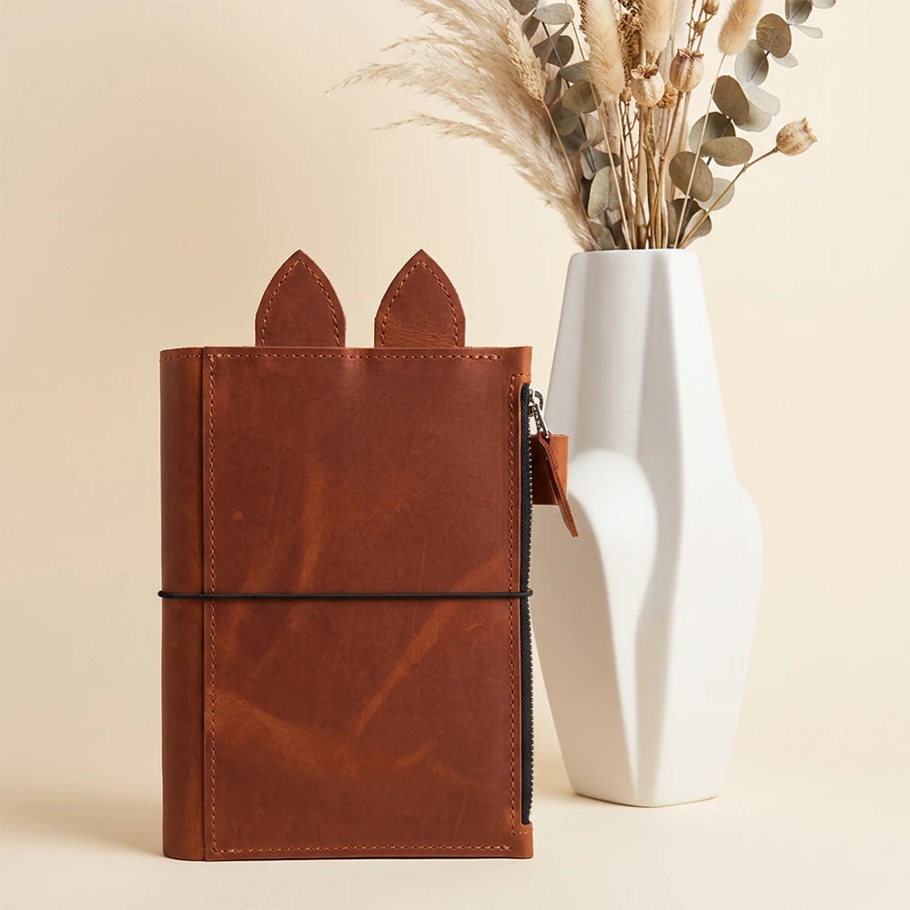 Planner cover with practical storage, pen support, and three elastic holders.