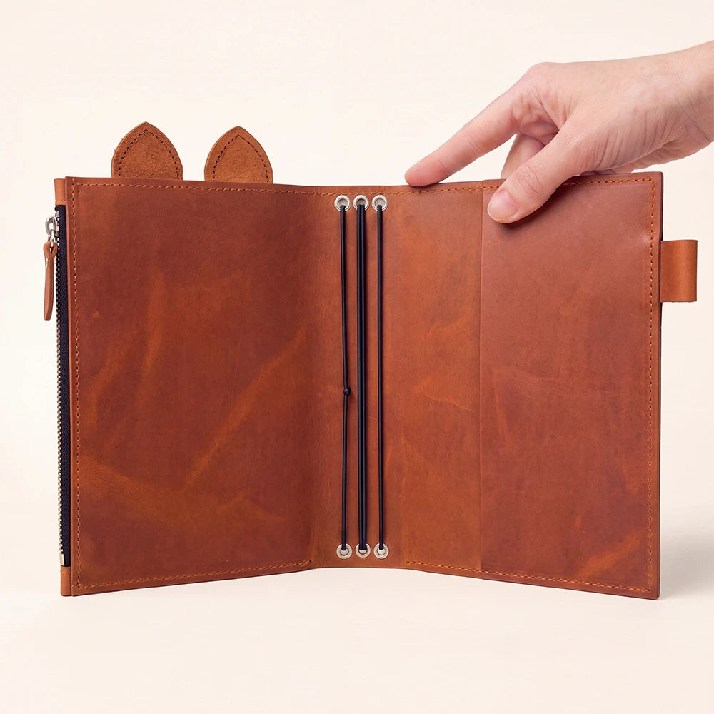 Natural leather notebook organizer with spacious zip pocket, pen loop, leather ears, and elastic bands.