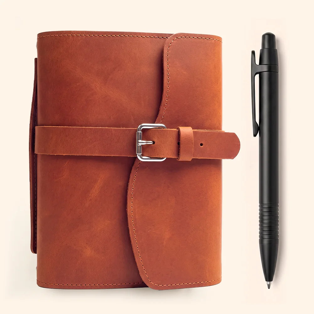 Genuine leather journal case with interior pockets, dedicated pen loop, bookmark, and sturdy outer handle.