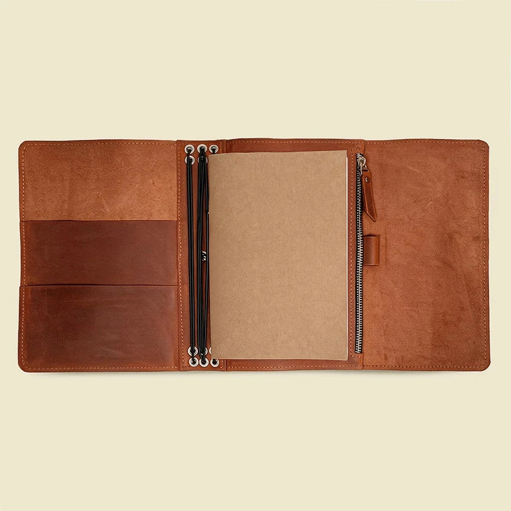 Natural leather notebook cover designed with practical pockets and six elastic inserts.