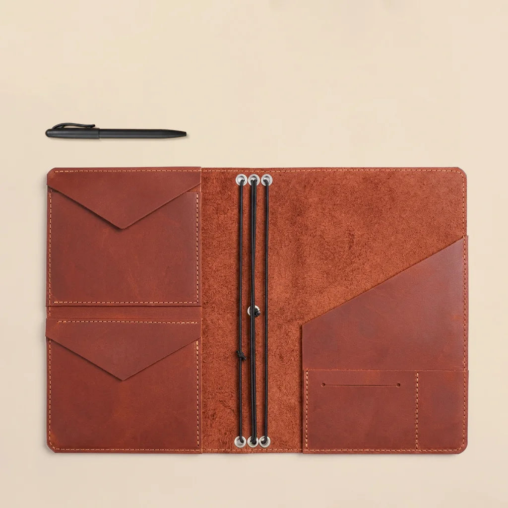 Leather notebook cover featuring interior organization for notebooks, cards, and small accessories.