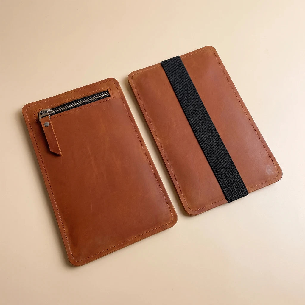Slim leather pocket for notebook cover with secure elastic band attachment
