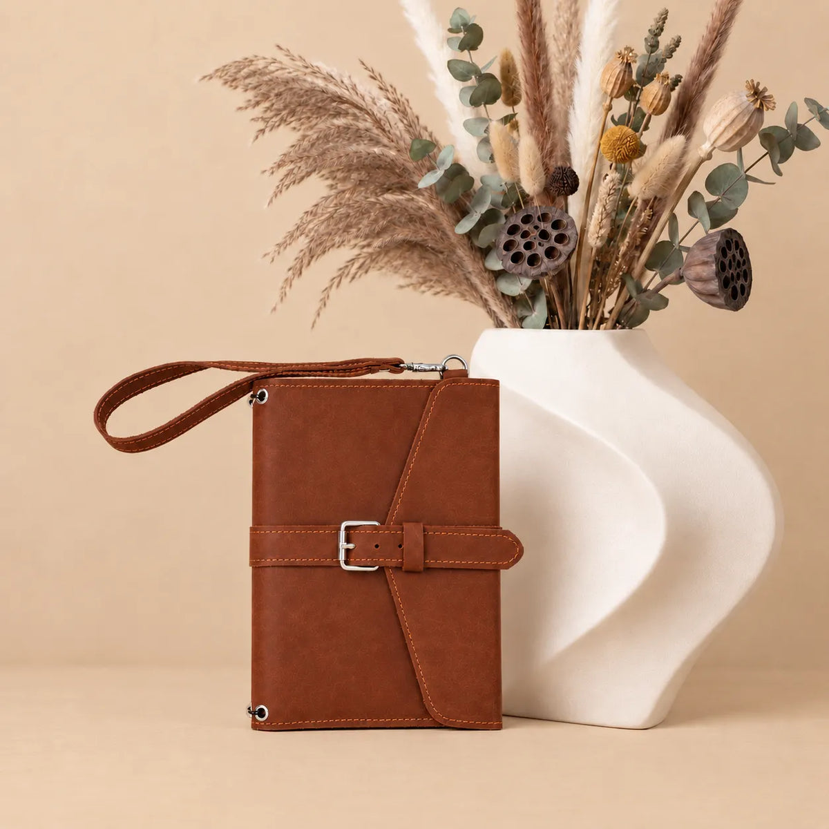 Handmade Crazy Horse leather journal cover featuring pockets and convenient wrist strap