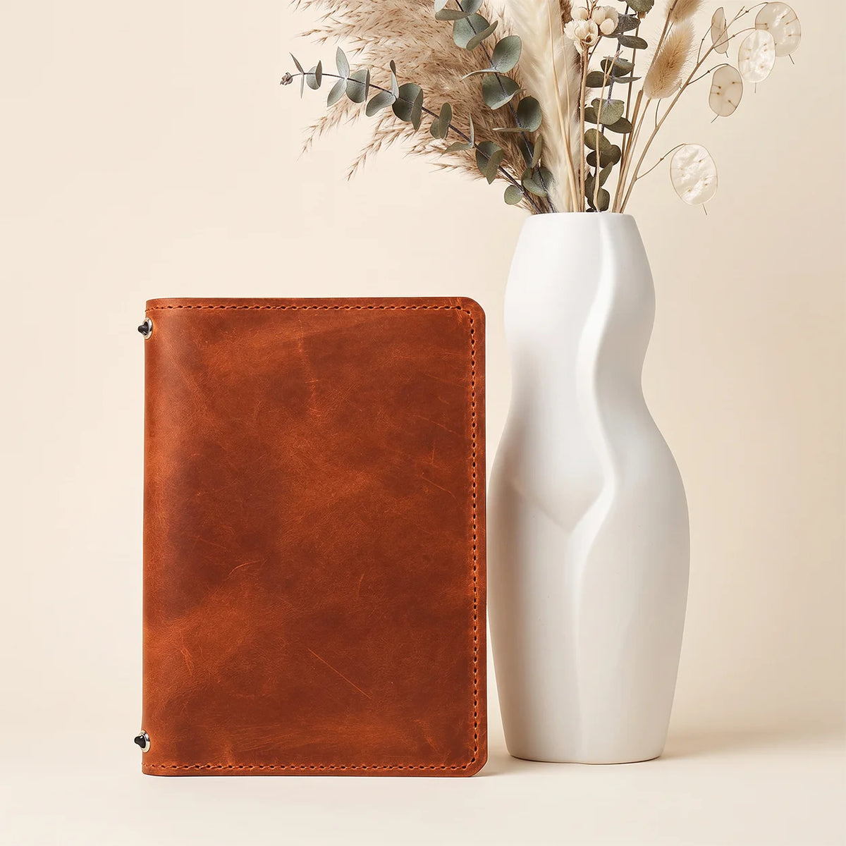 Handmade Crazy Horse leather journal cover featuring pockets and two elastic closures