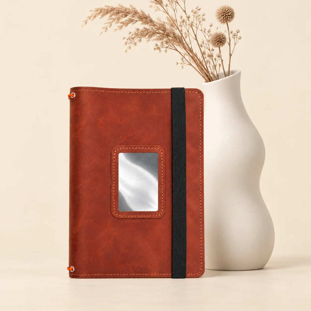 Genuine leather notebook cover with practical pockets inside and three elastic notebook bands.