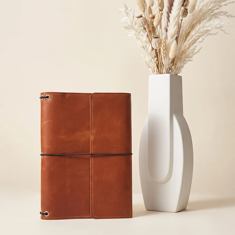 Handcrafted genuine leather notebook cover built for planners, journals, and creative everyday writing.