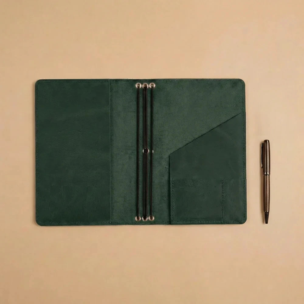 Handcrafted leather journal case with refillable notebook elastics and convenient storage features.