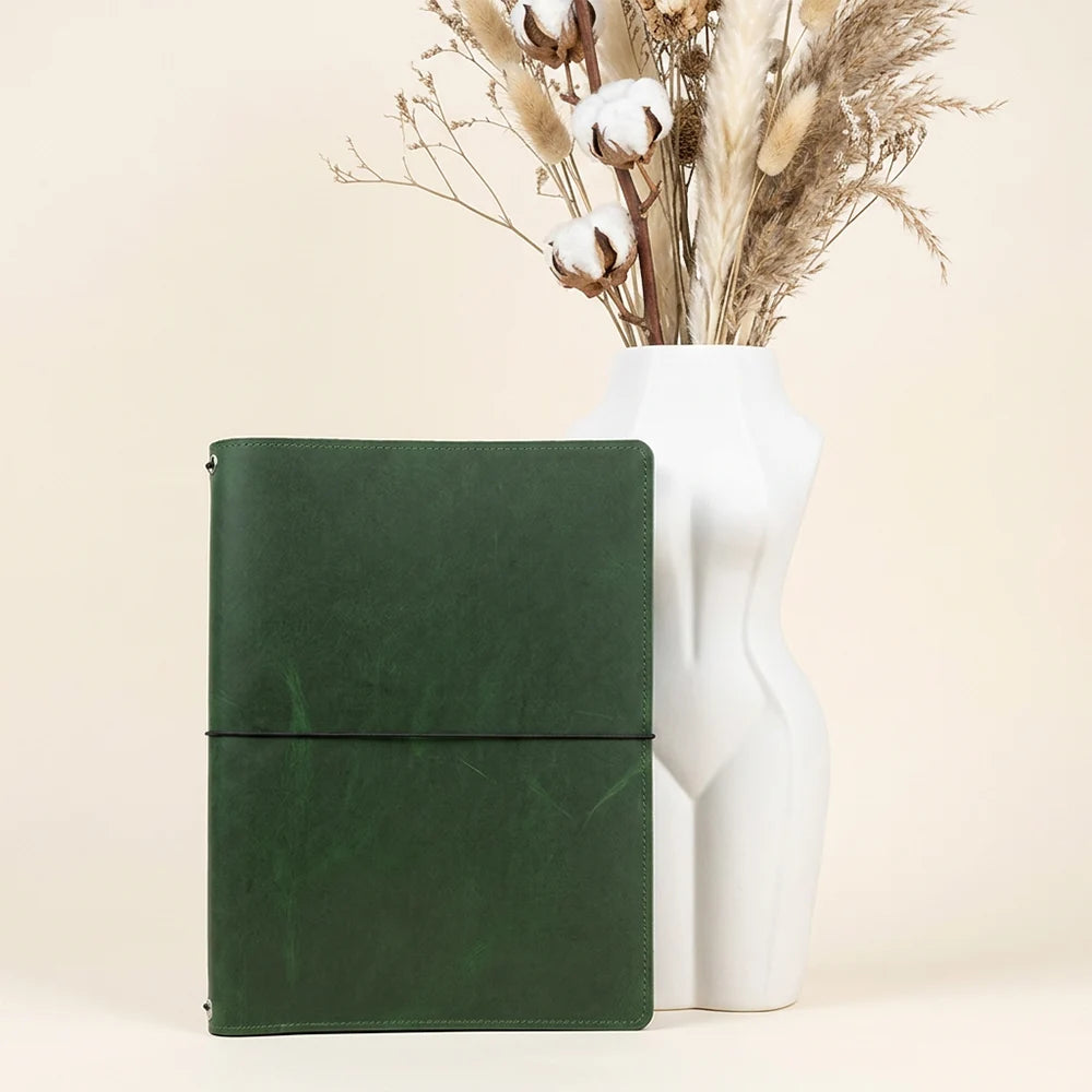 Leather notebook cover with three elastic straps and dedicated sketchbook attachment inside.