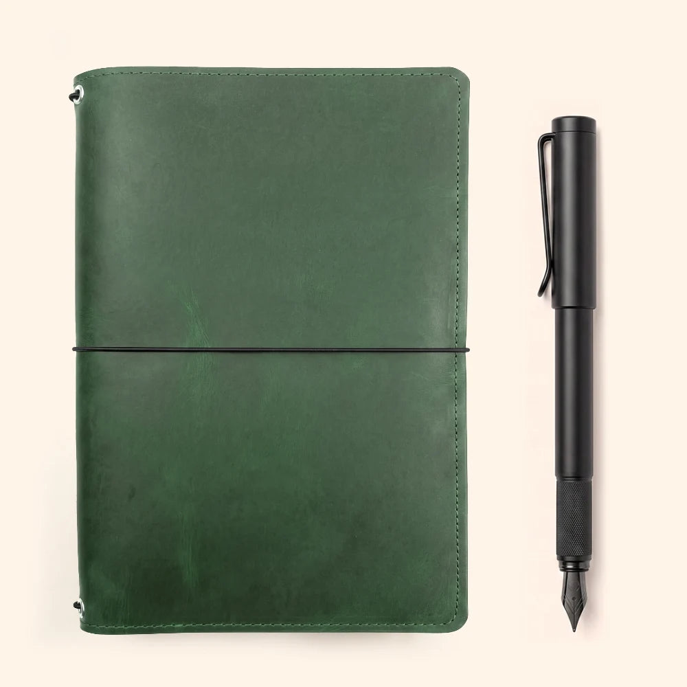 Refillable leather journal case with three secure elastics for interchangeable inserts.
