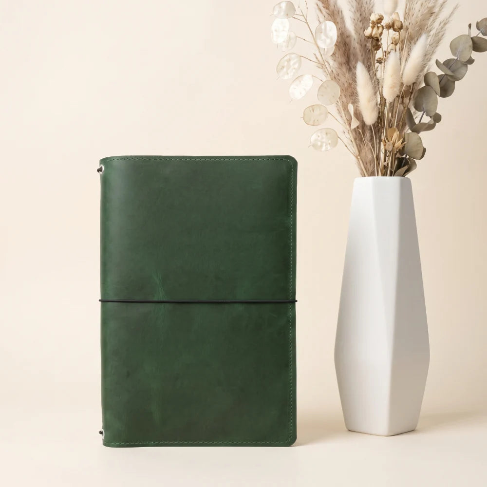 Durable genuine leather notebook cover designed with three secure elastic bands.