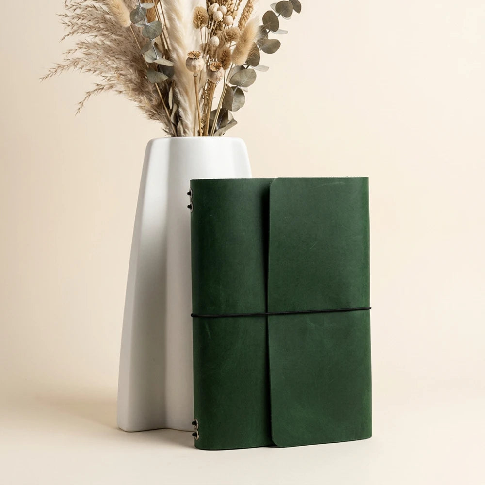 Premium refillable journal organizer with six interior elastic straps for flexible planning.