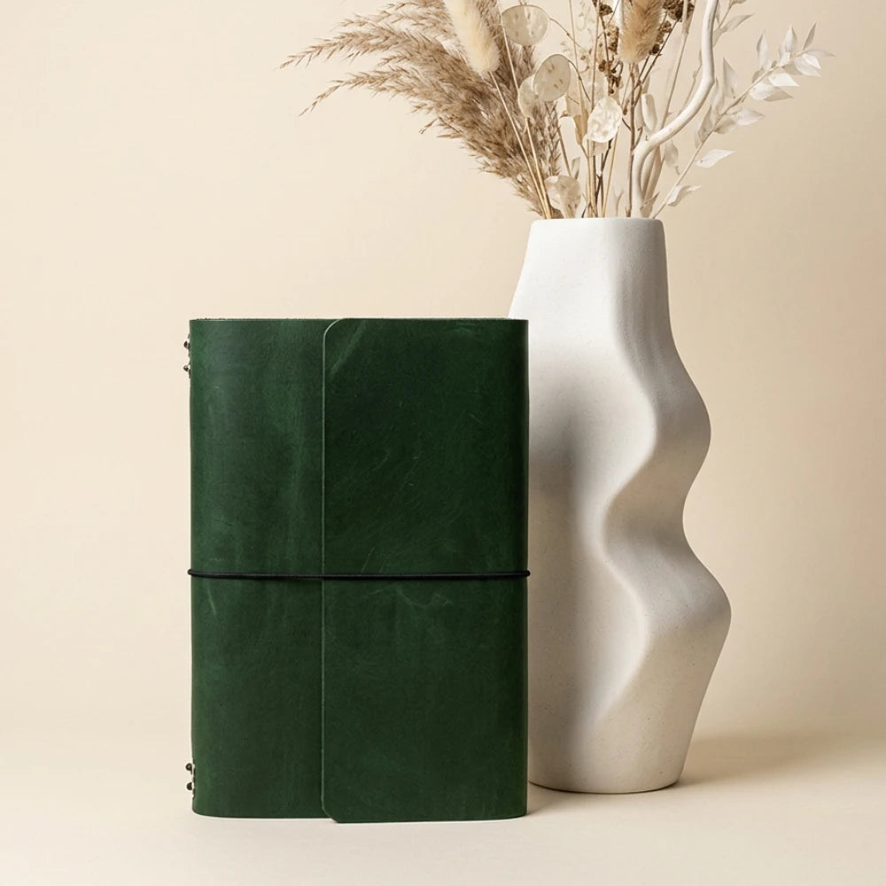 Natural leather organizer cover with six interior bands for arranging multiple refills.