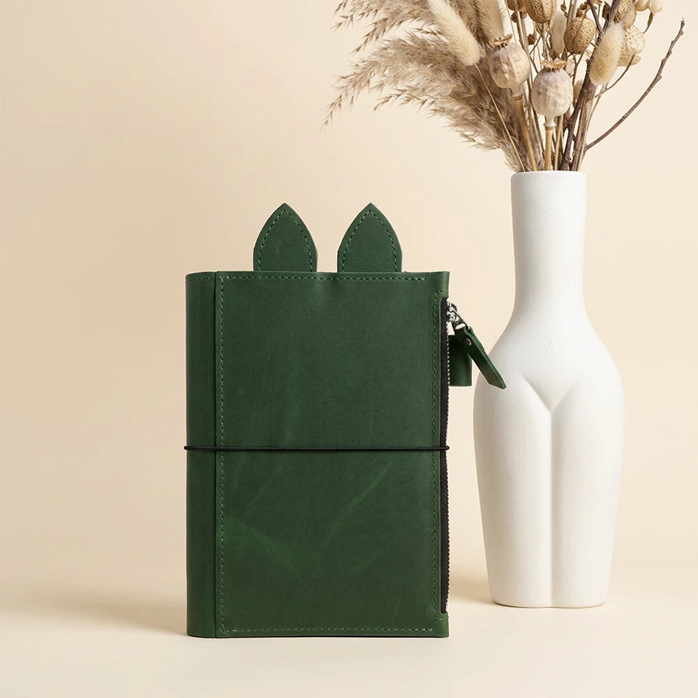 Handmade refillable journal case featuring playful leather ears and practical interior organization.