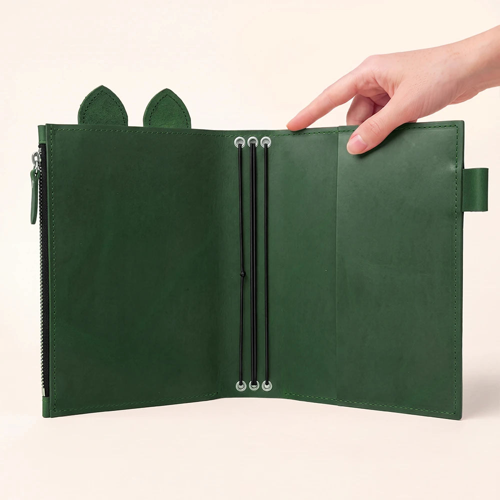 Open leather notebook case showcasing flexible elastic holders and practical storage pocket.