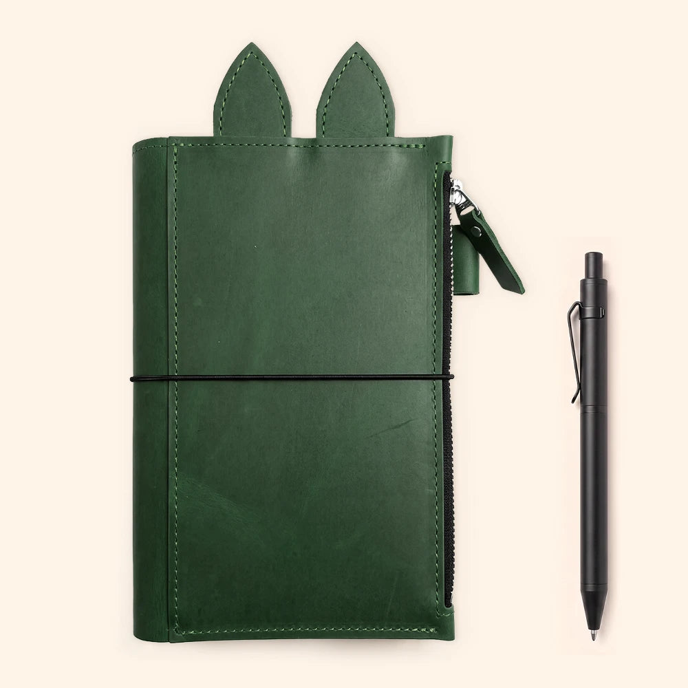 Leather notebook organizer with handcrafted stitching surrounding the interior panels.