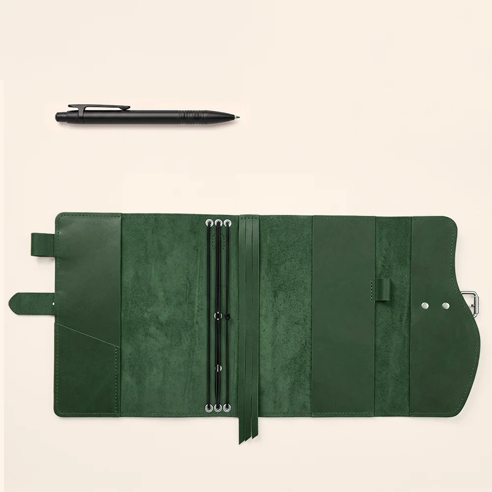 Handmade leather journal sleeve featuring functional pockets, secure pen holder, integrated page marker, and outer grip.