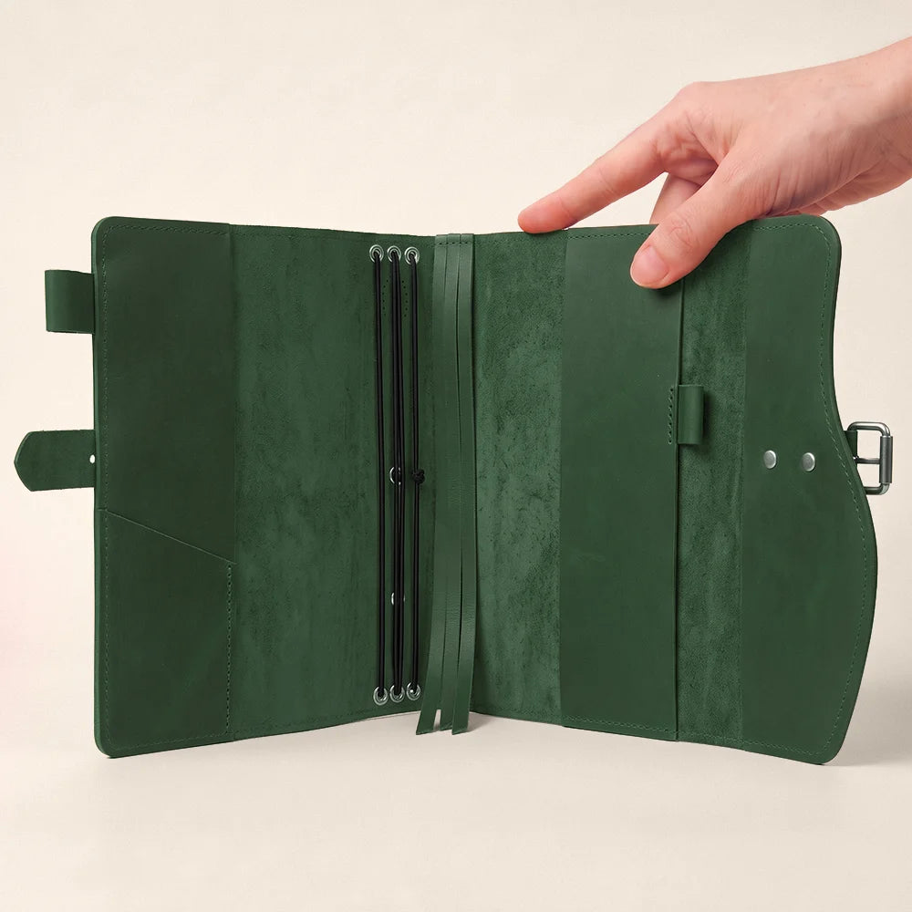 Genuine leather notebook cover combining storage pockets, pen loop, bookmark, and convenient external carrying handle.