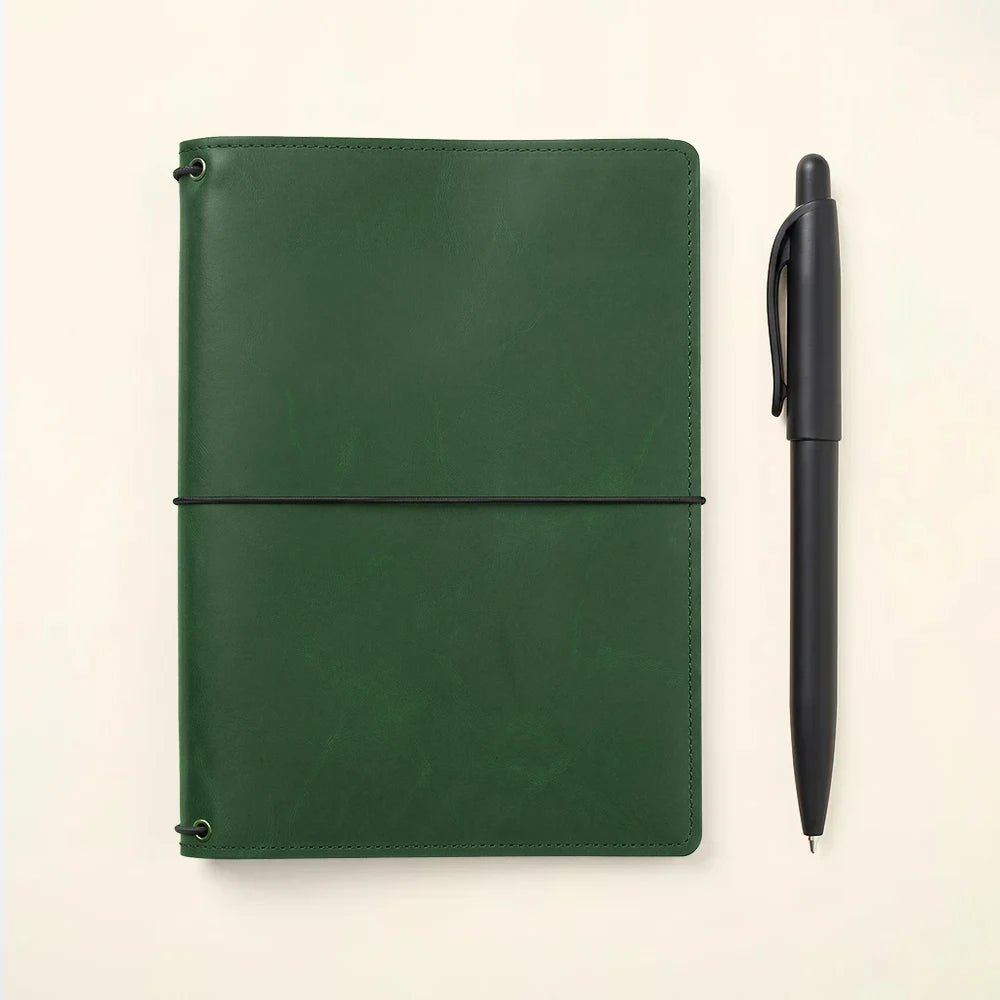 Leather travel journal cover featuring three elastic bands, pockets, and durable handmade construction.