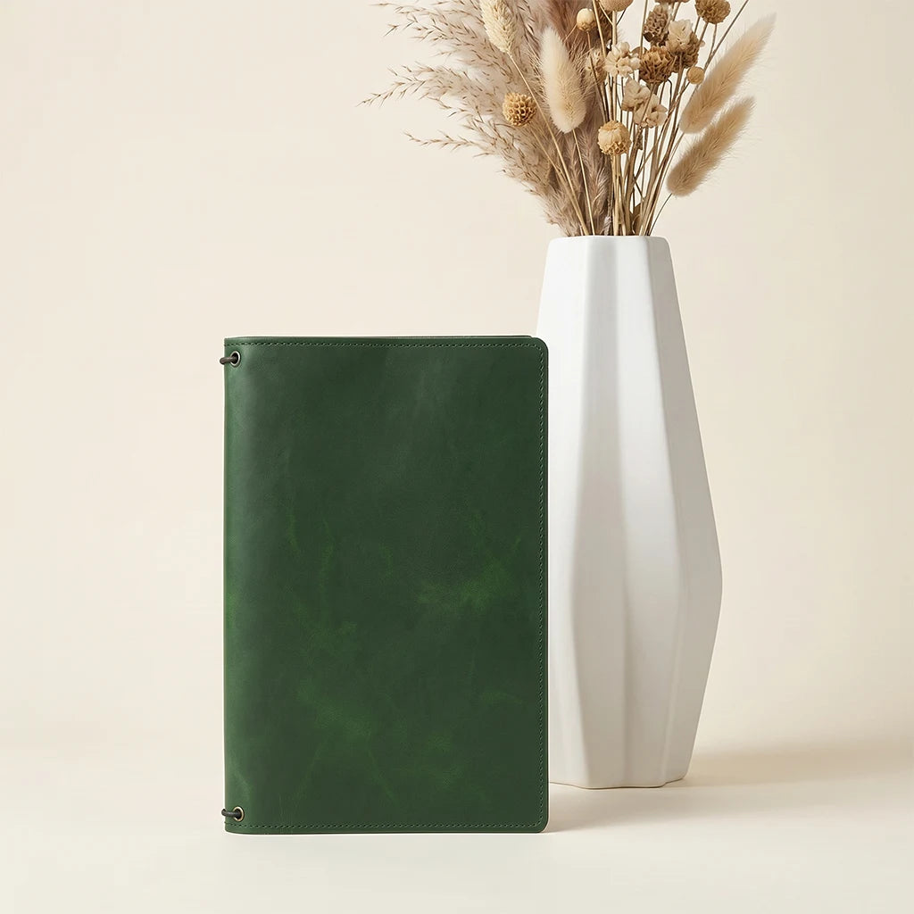 Handmade journal holder featuring durable construction and flexible elastic system.
