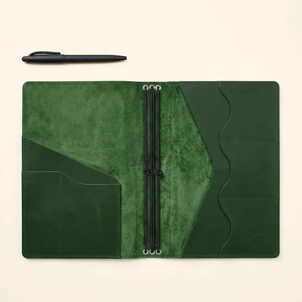 Full grain leather notebook cover with organized interior slots and three elastic holders.